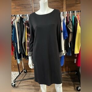 Size 8 French Connection. Size 8. Black Dress. Bling on Sleeve Hem. Lined.